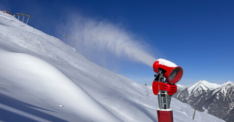 Snow machine on Austrian ski slopes during wintertime