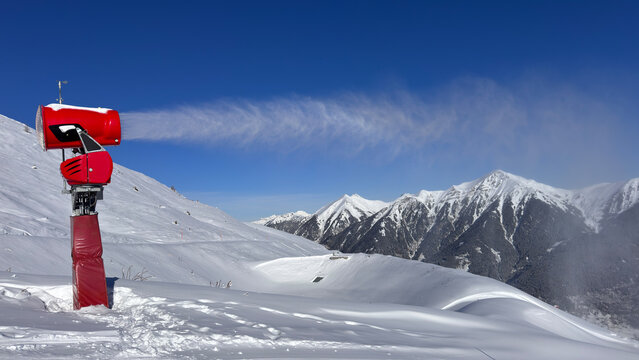 Snowmaker on Austrian winter ski slope in the Alps