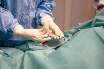 Nurse performing peripheral venous line insertion