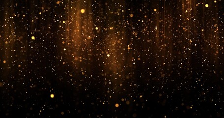 Sparkling amber light particles cascade on a dark background
