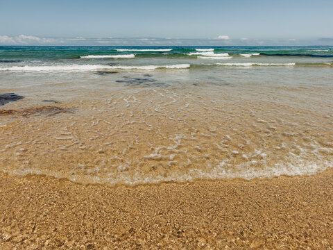 Sandy beach and waves on Portugal's west coast