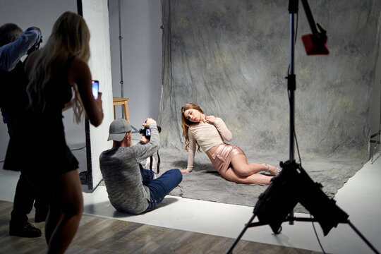 Model poses gracefully during a studio photo shoot session