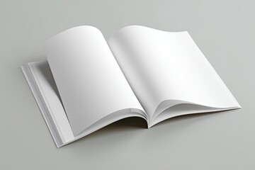 Open book/magazine with blank white pages, spread on a grey surface
