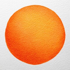 Orange watercolor circle on white paper with textured, granular appearance