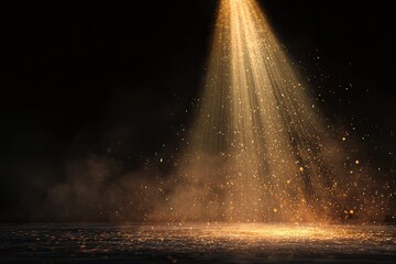 Golden light beam shines onto a dusty surface, against a dark backdrop