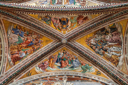 Italy - Orvieto - Duomo di Orvieto - Wide view of the cross vaulted ceiling with golden frescoes in San Brizio Chapel
