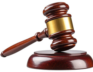 Close-up of a wooden gavel resting on its sound block against a stark black background