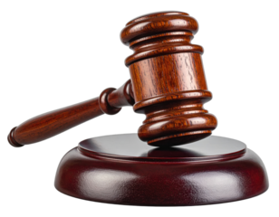 Close-up studio shot of a brown wooden gavel atop a matching sound block, isolated on black
