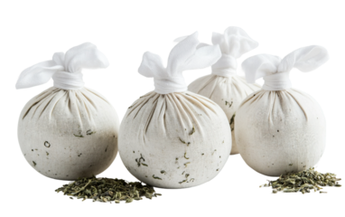 Handmade herbal compress balls with white cloth designed for relaxation massage and stress relief isolated on transparent background PNG