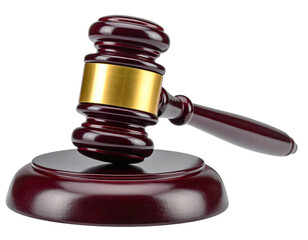 A wooden gavel, with a metallic band, resting on its matching base. Angled shot. Isolated