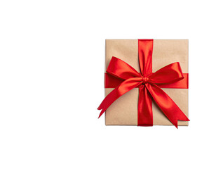 A square-shaped brown gift box tied with a vibrant red satin ribbon bow against a black backdrop