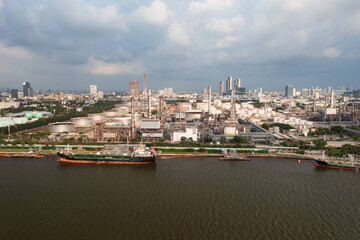 Fototapeta premium Bang Chak Oil Refinery is located along Chaopraya rivier in Bangkok, Thailand. Aerial view from a drone.