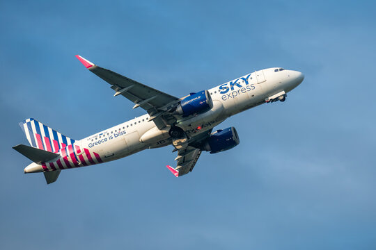 Sky Express Airbus A320 taking off into blue sky