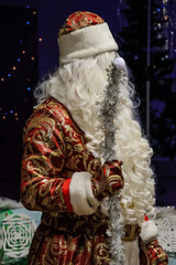 Russian Santa Old caucasian father frost in long warm coat, red mittens 
