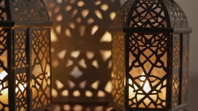 Cinematic macro glide of ornate metal lanterns with warm flickering LED lights and intricate geometric shadows.