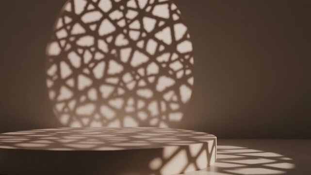 Minimalist product podium with moving Islamic geometric shadows and elegant gobo lighting in a warm studio setting.