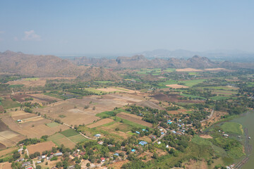 Obraz premium A top down view from a drone of a agricultural field in Thailand ready for new growing season