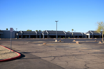Bright sunny Sunday morning at empty local shopping plaza, Phoenix, Arizona; copy space