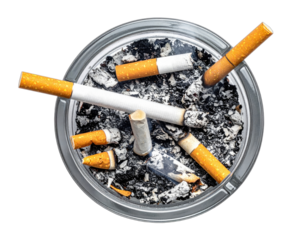 Overhead shot of a glass ashtray filled with extinguished and partially smoked cigarettes