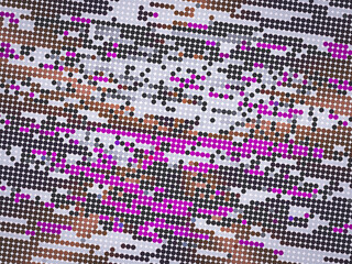 A pattern of dots in a variety of colors, including pink and brown