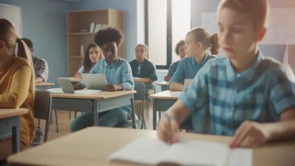 Diverse group of elementary school children learning in modern classroom setting with technology - Powered by Adobe