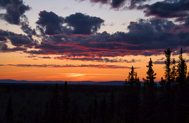 Pink light at the bottom of clouds in Alaska