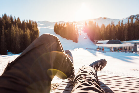 POV of skier&rsquo;s legs and boots enjoying sunny ski break