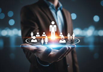 Businessman hand holding human icon for customer value and customer relation management concept.