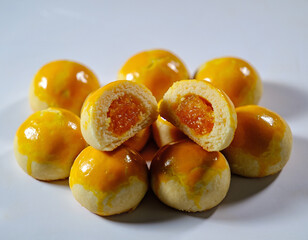 Nastar is a typical Indonesian pastry with a soft, buttery texture and a round shape. The exterior is baked until golden brown with a glossy egg wash, while the interior is filled with sweet, rich, an