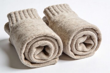 Wool socks rolled in a simple style, ready for use in a cozy setting during the colder months of the year with no labels or identifying marks visible