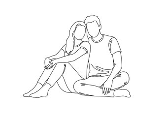 Obraz premium Young couple sitting together in a relaxed pose on the floor 