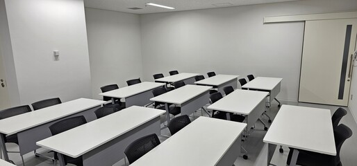 Empty modern classroom interior with desks and copy space for education and training