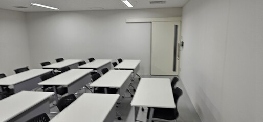 Empty modern classroom interior with desks and copy space for education and training
