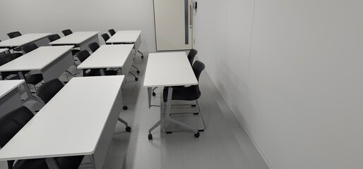 Empty modern classroom interior with desks and copy space for education and training