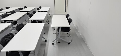 Empty modern classroom interior with desks and copy space for education and training