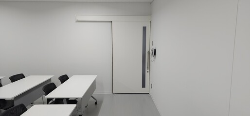 Empty modern classroom interior with desks and copy space for education and training