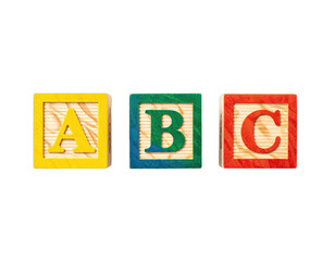 Bright, primary-colored wooden blocks with ABC letters on display against a black background