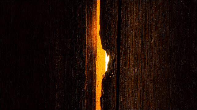gamestop. A thin golden light from a crack in dark wood, suggesting hidden space. travel magazines, destination branding, designed for travel destination branding, used by product managers.