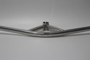 Vintage bullmoose bicycle handlebar made of polished metal, isolated on white background. Classic...