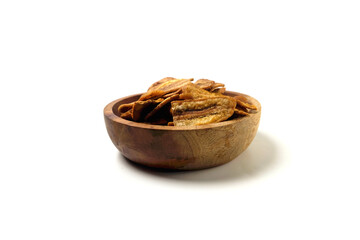 caramel banana chips in a bowl isolated on a white background