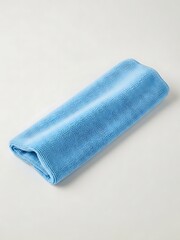 Soft azure cleaning cloth on light background with folded edge design