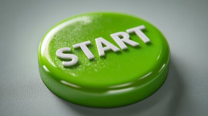 A vibrant, close-up shot showcasing a glossy green button with the white word "START". Button rests on a pale, textured surface