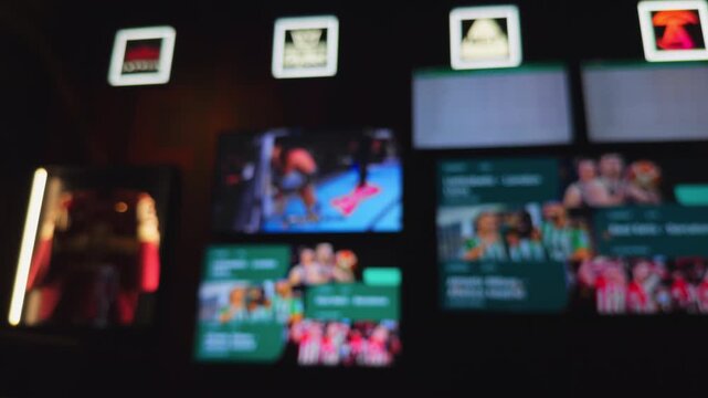 Dim bar illuminated by neon reflections, Multiple TVs cast footage amid vibrant nightlife ambiance