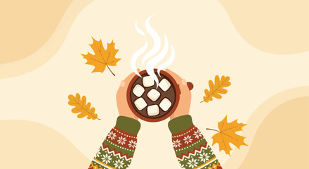 Hands holding steaming cup of hot chocolate surrounded by autumnal leaves illustrating a cozy fall beverage experience