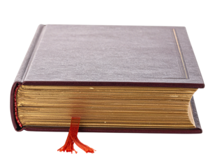 A Closed Hardcover Book with Gilded Edges and a Red Bookmark.