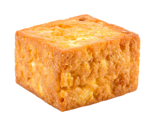 A single cube of fried tofu on a white background.