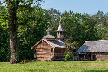 Chapel from the village Kashira of Malaya Vishera district in the Vitoslavlitsi open-air Museum of Folk Wooden Architecture on a sunny summer day, Veliky Novgorod, Russia