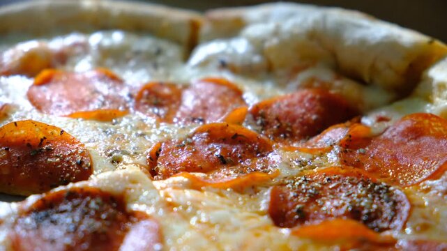Tasty hot pepperoni pizza. Hot Spicy Pizza with chilli pepper, salami, mozzarella cheese and tomato ketchup, restaurant food. Sunlight	