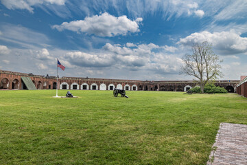 Fort Pulaski: Historic brick fort, cannons, flag, and green lawn.
