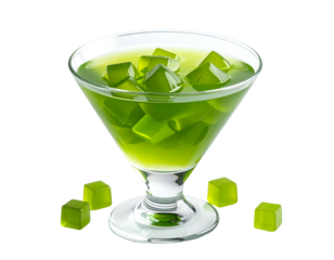 Vibrant green gelatin cubes in a stemmed glass with scattered pieces